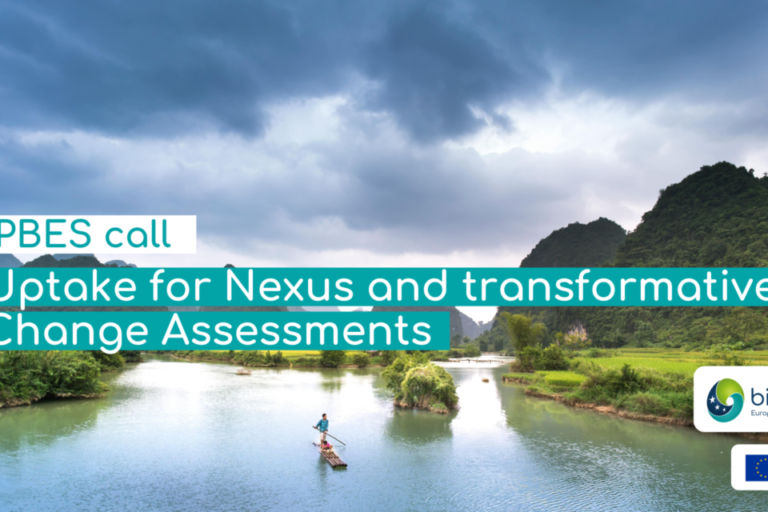 Men on boat in lake Photo by Quang Nguyen Vinh